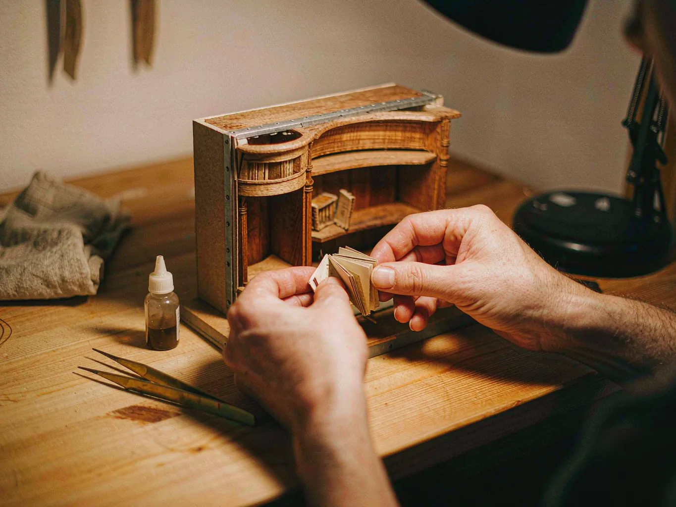 Placing a miniature book into a Norviel kit